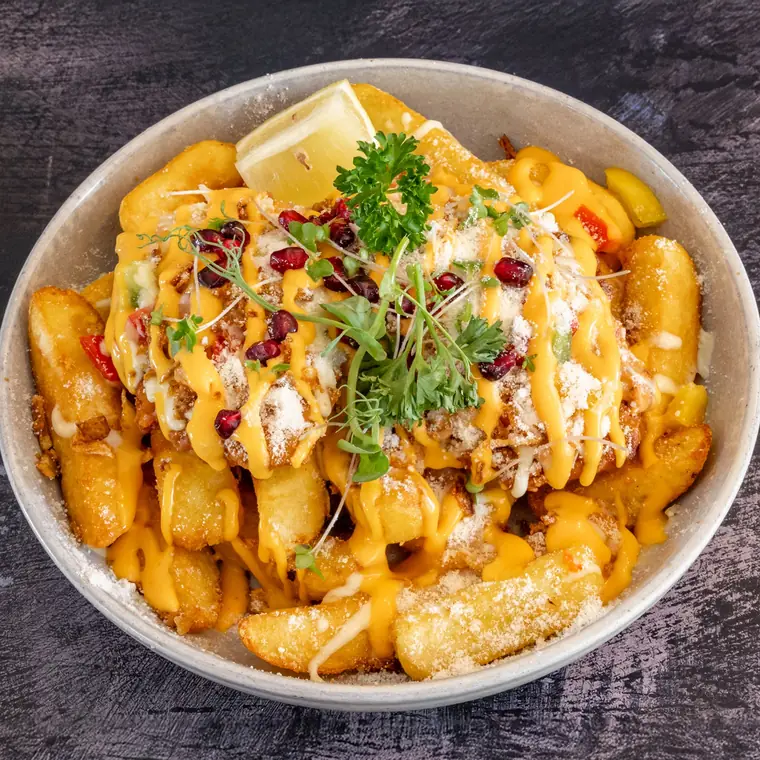 Parmesan chicken with béchamel, mozzarella and crispy fried onions.